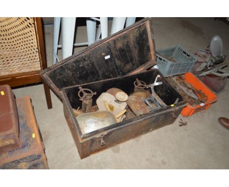A metal storage trunk and five various balance scales