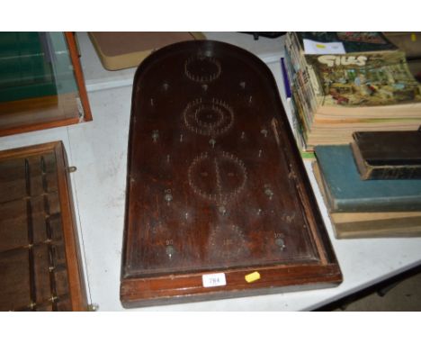 A bagatelle board complete with 15 steel balls