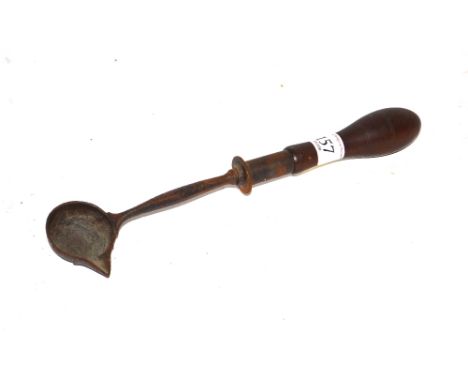 An early Antique metal ladle with turned wooden handle