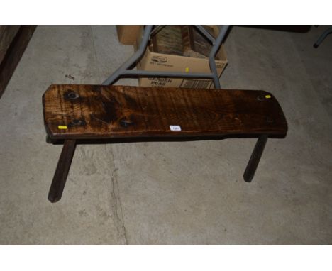 An old elm rustic pig bench