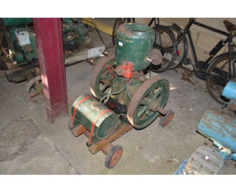 A Lister A29 3hp stationary engine, on four wheel trolley