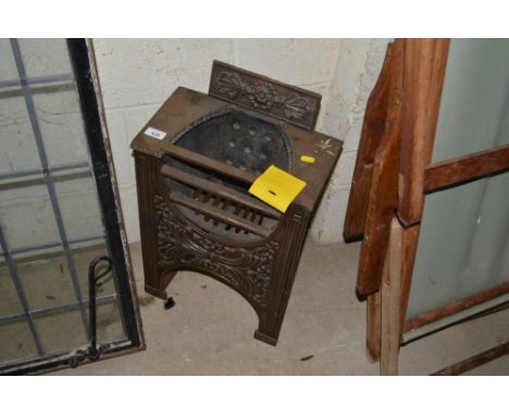 A small cast iron fire grate