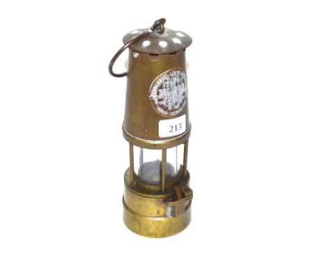 A miner's lamp by the Protector Lamp and Light Company Ltd. Eccles, Manchester