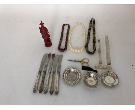 A collection of miscellaneous items including white metal dishes, scent phiales, agate bone necklaces, tea knives and a Chine