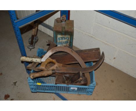 An Esso Blue fuel can and various hand tools