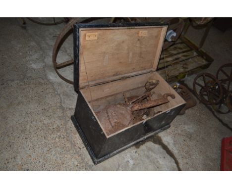 A painted wooden toolbox and contents to include cast iron scales, lasts, wrenches, spanners etc.