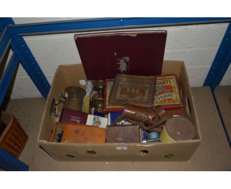 A box containing a collection of vintage games, an oil lamp, glass lemonade jug etc.