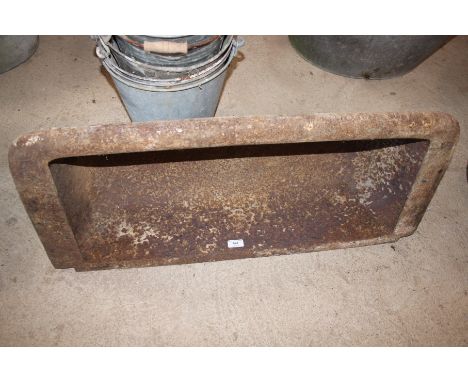 A wall hanging cast iron trough 