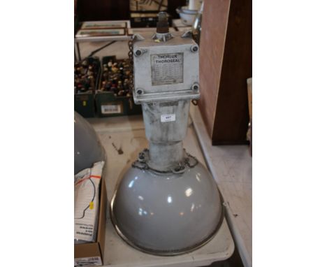 A large grey spot lamp with bulb