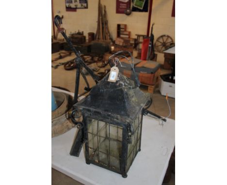 A metalware hanging porch lamp and bracket 