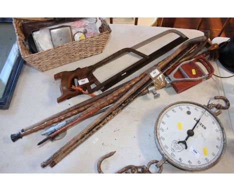 A vintage shooting stick and various other walking canes etc.