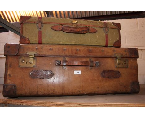 A large leather travelling trunk by Cave & Sons of London; together with a canvas trunk