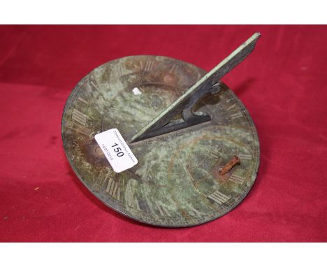 A brass sundial by J Fowler of London