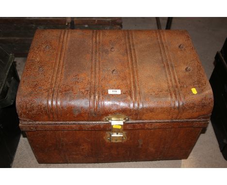 A tin trunk with brass catch