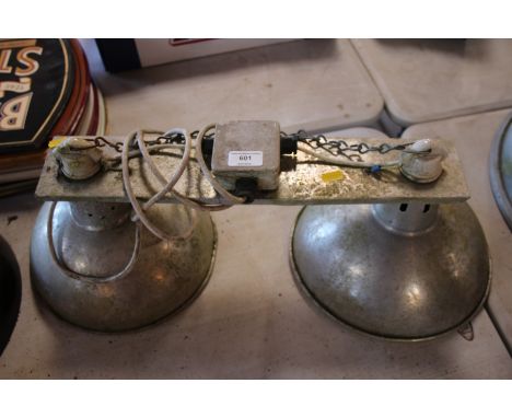 An industrial twin ceiling lamp