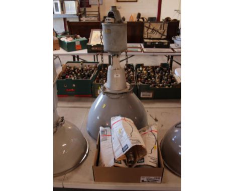 A large grey spot lamp with bulb