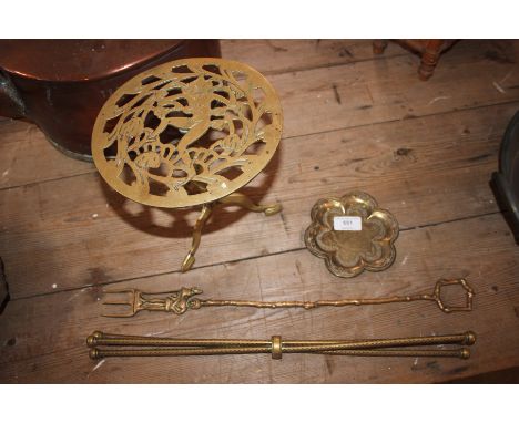 A brass trivet; a brass toasting fork etc. 