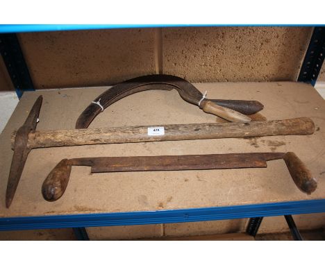 A small pit pick axe, hurdle shaper and two hand sickles