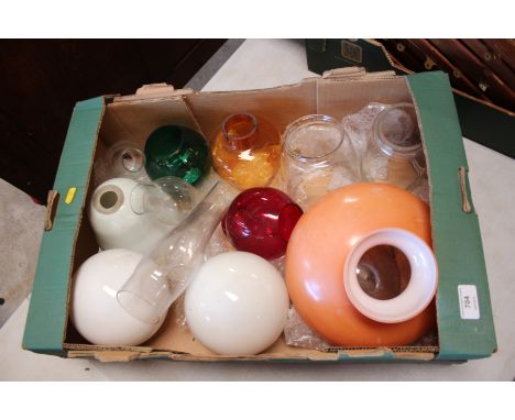 A quantity of glass chimneys and light shades for lamps 