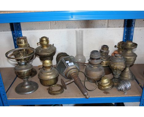 A large quantity of brass oil lamp bases, carriage lamp etc. 