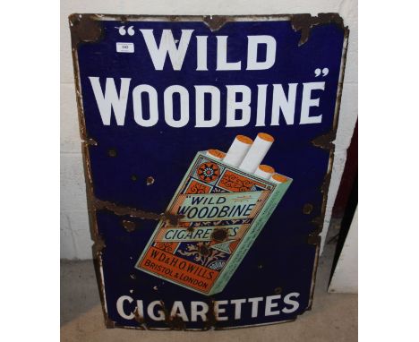 An enamel advertising sign for "Wild Woodbine Cigarettes", (93cm x 62cm approx.)