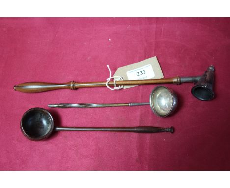 A candle snuffer; a small silver ladle and a small wooden ladle