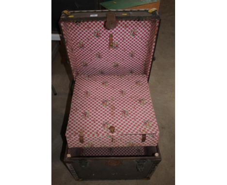 A small square fitted travelling trunk