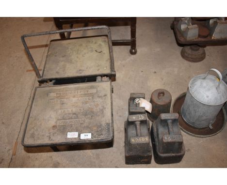 A set of Isle of Eley Scale Co. makers of Wisbech coal scales and a quantity of weights