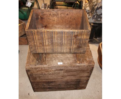 A large pine trunk marked "London" and a Canadian apple box