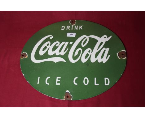 An enamel "Drink Coca Cola Ice Cold" oval advertising sign, (45cm x 37cm approx. overall)