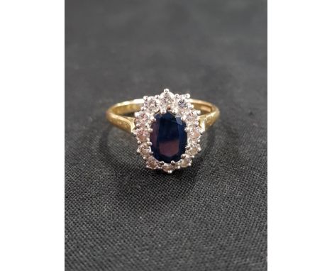 18 CARAT GOLD SAPPHIRE AND DIAMOND CLUSTER RING