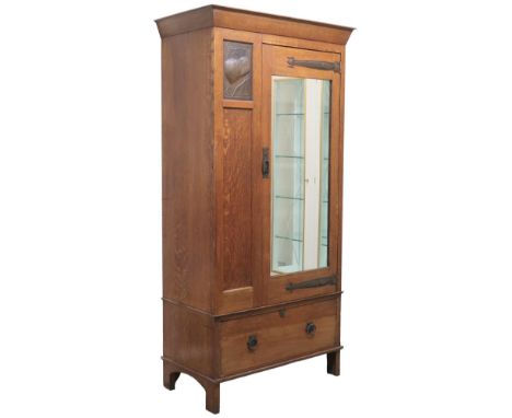 AN OAK ARTS &amp; CRAFTS HARRIS LEBUS MIRROR DOORED WARDROBE&nbsp; with plain shaped cornice over single mirror door with sty