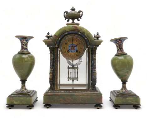 A FRENCH CHAMPLEVE ENAMEL AND ONYX CLOCK GARNITURE the domed top with urn above, with four supporting columns, rectangular ba