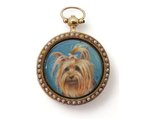 A YORKSHIRE TERRIER PORTRAIT MINIATURE painted on ivory and mounted inside a yellow metal fob watch case. The bezel is set wi