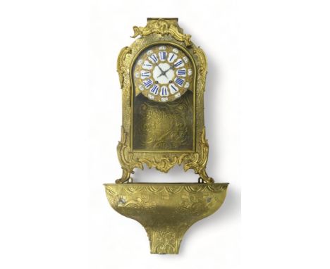A LARGE FRENCH BRASS TIMEPIECE of Rococo style, the dial with white markers with blue roman numeral details and further minut