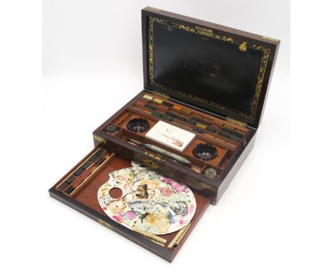 A VICTORIAN BRASS-BOUND ROSEWOOD ARTIST'S PAINT BOX BY REEVES AND SONS, LONDON Containing an array of watercolour paint block