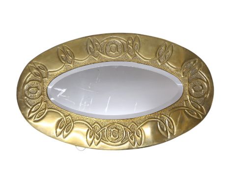A GLASGOW SCHOOL ARTS AND CRAFTS WALL MIRROR of oval form with Celtic knotwork decoration, 77cm long Condition Report:Availab