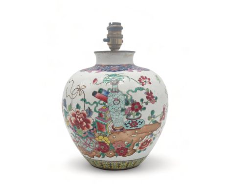 A CHINESE FAMILLE ROSE JAR Painted with precious objects within foliate borders, blue reign mark, 20.5cm high Condition Repor