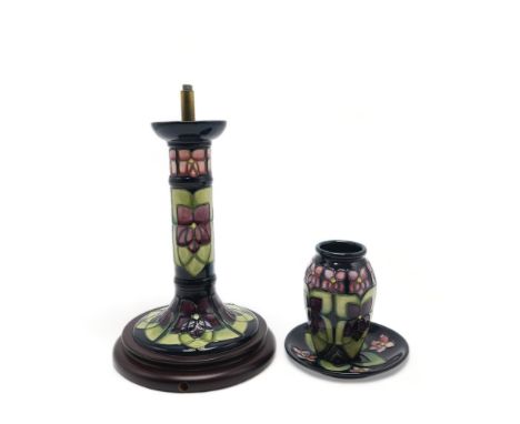 THREE PIECES OF MOORCROFT VIOLET PATTERN CERAMICS including a table lamp, a vase 11cm high and a coaster / trinket dish,  11.