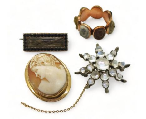 FOUR ANTIQUE JEWELS to include a rose coloured metal lava cameo ring, each of the seven panels with a different face, finger 