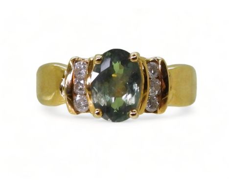 AN ALEXANDRITE AND DIAMOND RING set in 18ct yellow gold the ring retailed by GemsTV is set with a 8mm x 6mm alexandrite, with