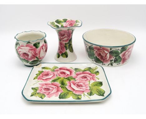 A SMALL GROUP OF WEMYSS WARE all painted with cabbage roses including a dog bowl, a tray, 26cm x 21cm, a Lady Eva vase, 16cm 