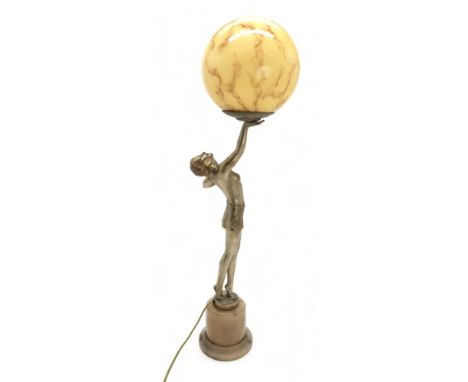 AN ART DECO GILDED SPELTER LADY LAMP modelled standing on tiptoes, holding the glass ball shade aloft Condition Report:"No in