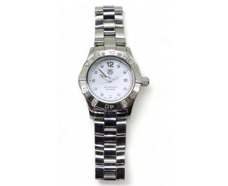 A DIAMOND TAG HEUER AQUARACER this ladies model has a mother of pearl dial and diamond set numerals and bezel, diameter 2.8cm