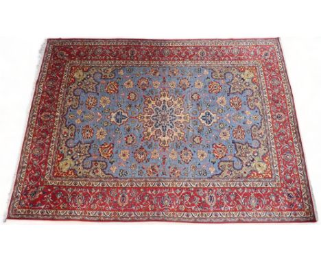 A LIGHT BLUE GROUND TABRIZ RUG&nbsp; with multicoloured sunburst central medallion on floral patterned ground with beige span