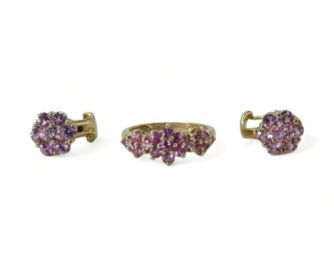 PINK SAPPHIRE FLOWER SUITE comprising of a 9ct gold ring, finger size K, with a pair of similar earrings with clip &amp; post