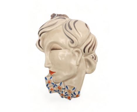 A CLARICE CLIFF WALL MASK circa 1936, moulded as a lady in profile with blue and orange flowers around&nbsp;her neck, with mu