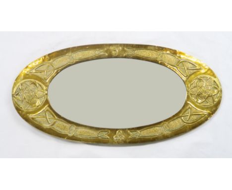 A GLASGOW SCHOOL CELTIC REVIVAL WALL MIRROR&nbsp; of oval form with knotwork decoration, 85cm long Condition Report:Available