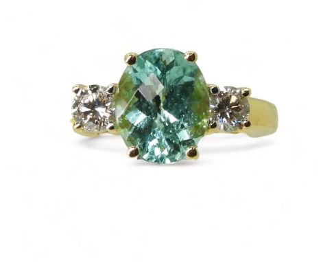 AN APATITE&nbsp;AND DIAMOND RING set with a checkerboard cut apatite of 9.7mm x 7.9mm, in the classic three stone configurati