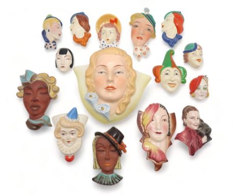 A COLLECTION OF CZECHOSLOVAKIAN ART DECO WALL MASKS modelled as female heads with painted decoration, ranging in size from 7c
